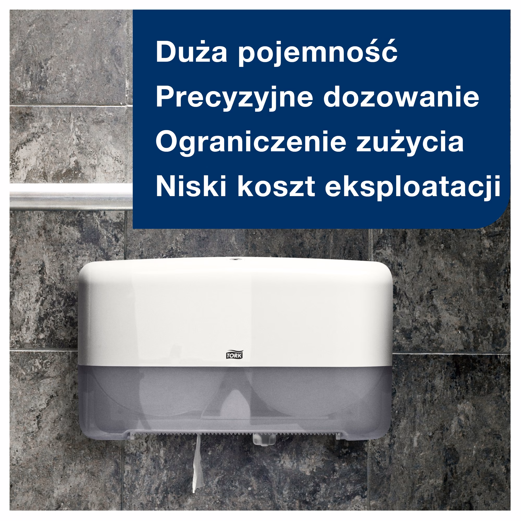 Papier toaletowy Tork Mini Jumbo T2, biały dozownik ścienny na tle szarych kafelków