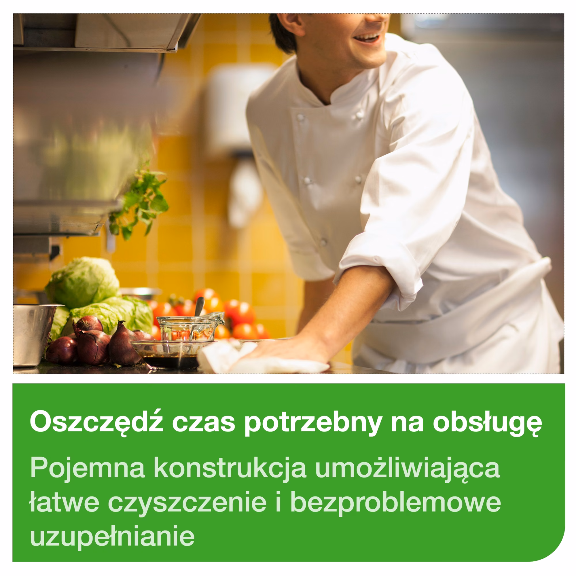 Dozownik Tork system M2, kucharz wycierający blat w profesjonalnej kuchni